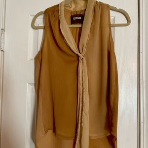 Ladies’ Reformation two-toned sleeveless blouse with contrasting tie. Tan/cream